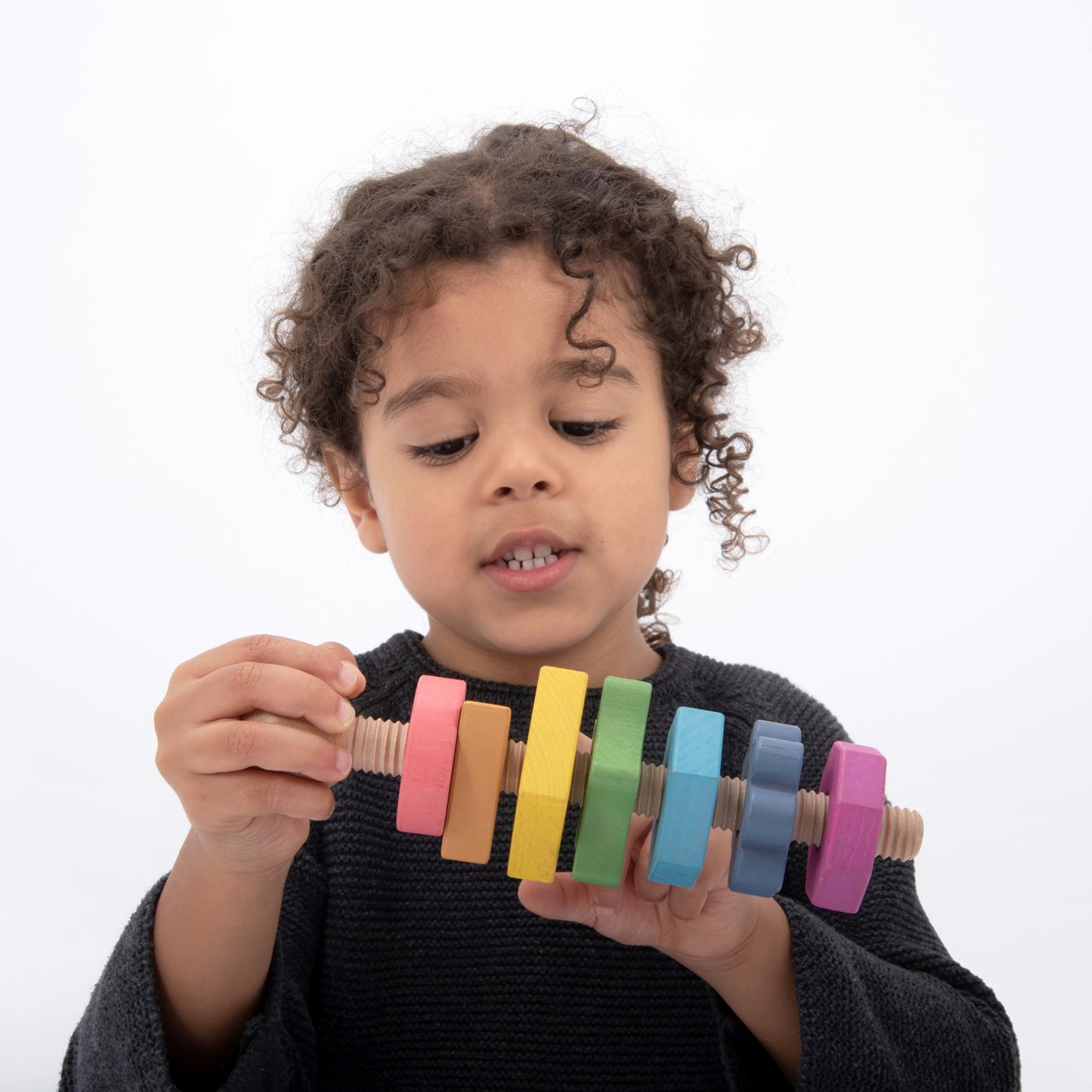 Rainbow Wooden Shapes on a Giant Bolt