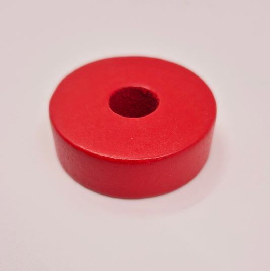 Red wooden disc with hole