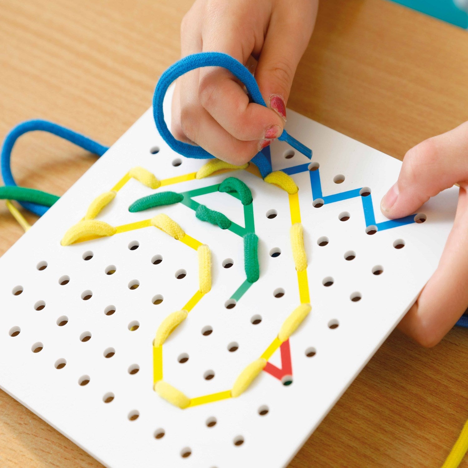 Montessori Threading Bug – Absorbent Minds Montessori